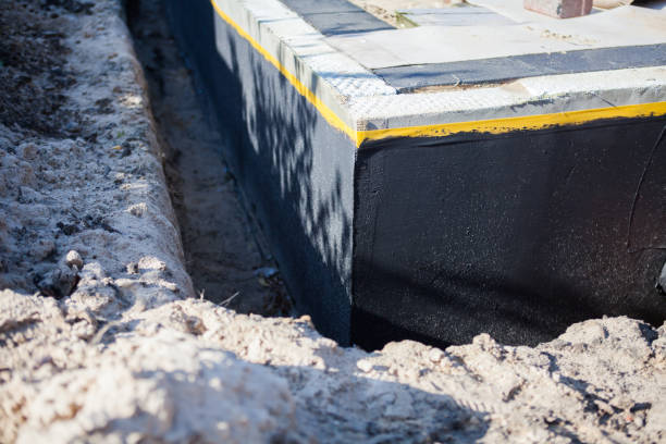 Professional Waterproofing technician working in Clio, MI